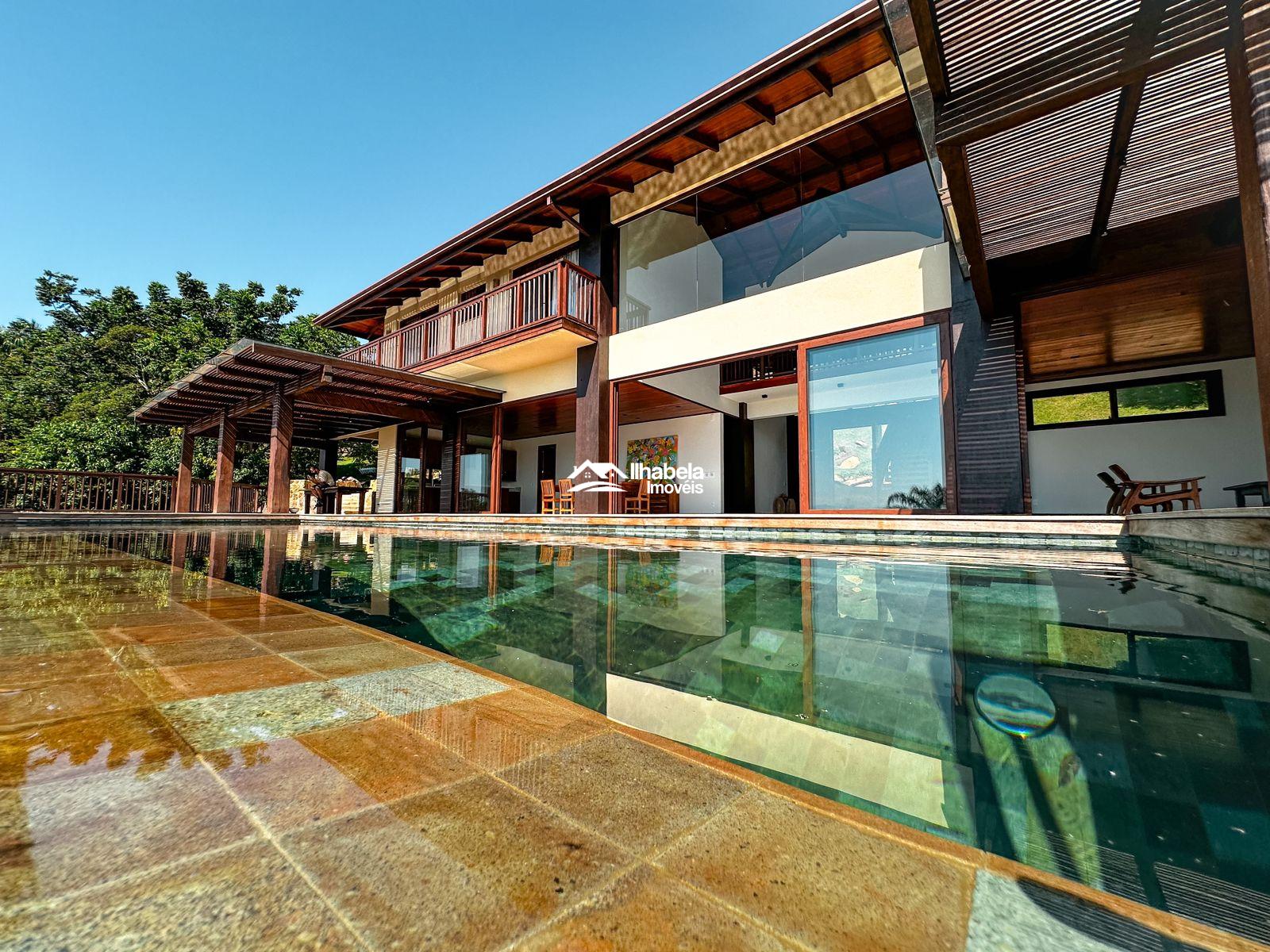 Casa de luxo em condomínio pé na areia